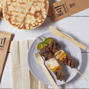 HAY Bamboo Cutlery About Page, Image shows meat and vegetble skewer plate with HAY bamboo cutlery on the side with hHAY cutlery set