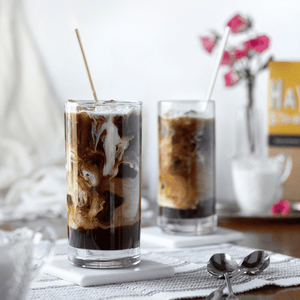 HAY! Straws In an iced coffee presented in a tall glass