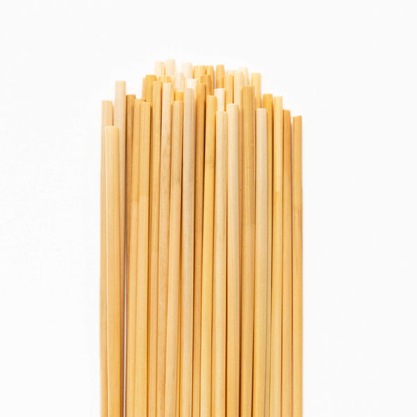 HAY! Straws original wheat stem straws on white background showing the 7.75 inch length and natural color variation of the plant stem straws