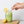 HAY Straws Jumbo Slim Straws made from reed plant stems, a biodegradable smoothie straw,  green smoothie with a natural straw and a woman's hand reaching for the straw, 8” length, non soggy straws, compostable straws, natural straws